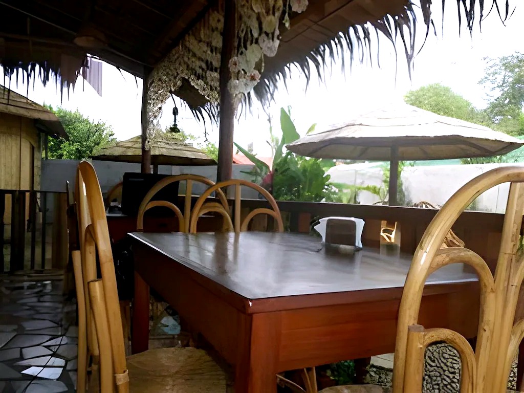 Common area seating and bar space at La Petite Pension
